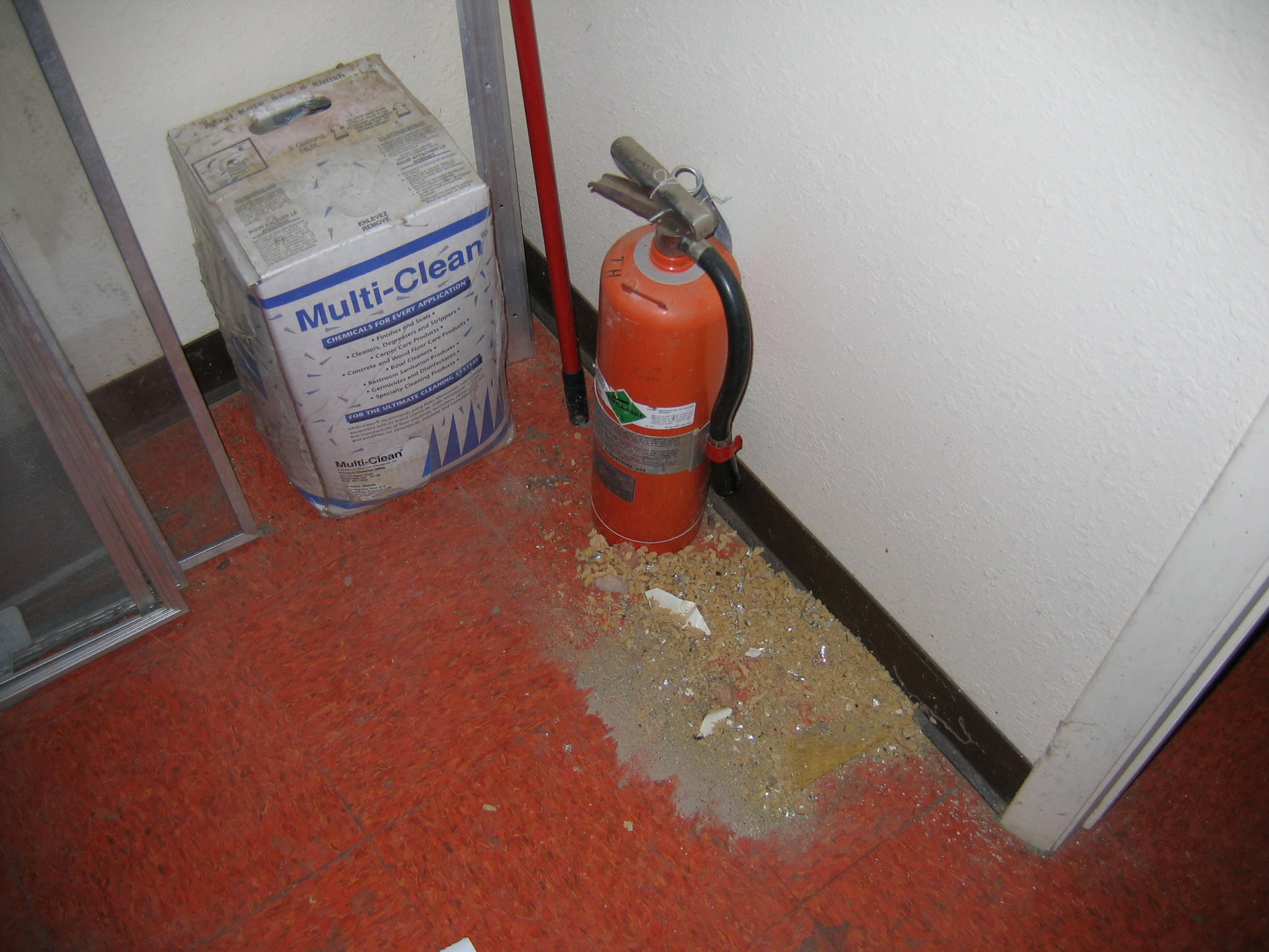 Poor housekepping with debris on floor anf fire extinguisher not mounted or inspected