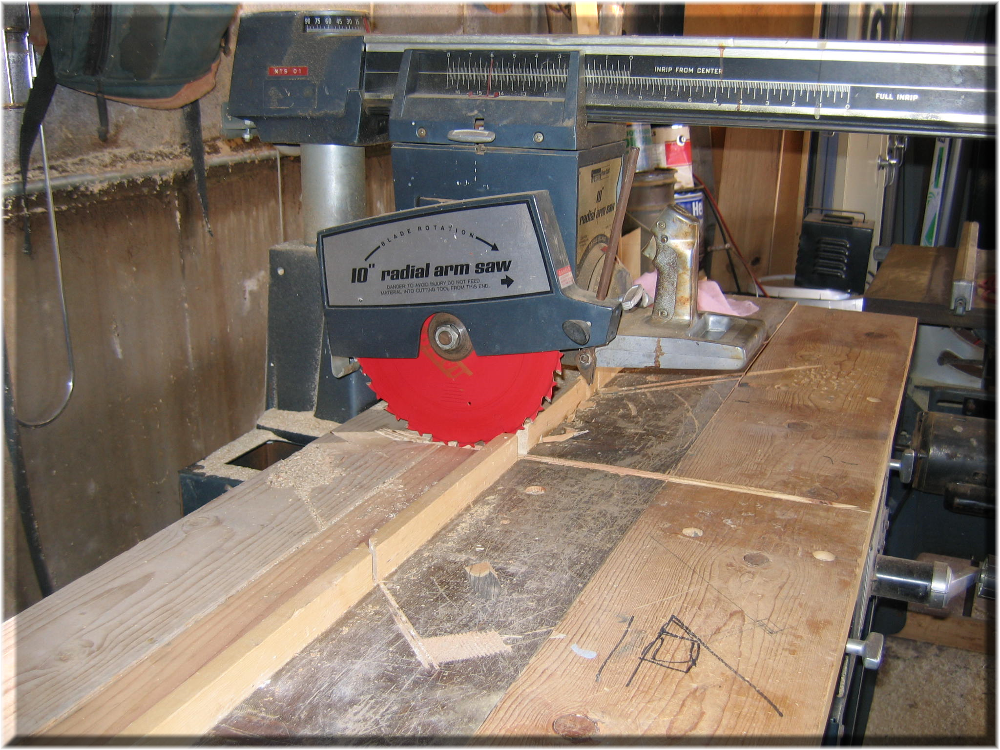 This radial arm saw is missing its bottom guard severe struck by hazard